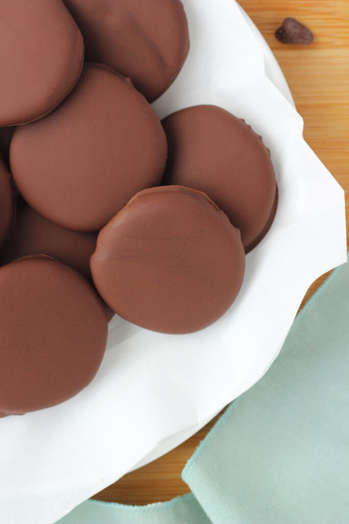 white plate stacked with peppermint patties