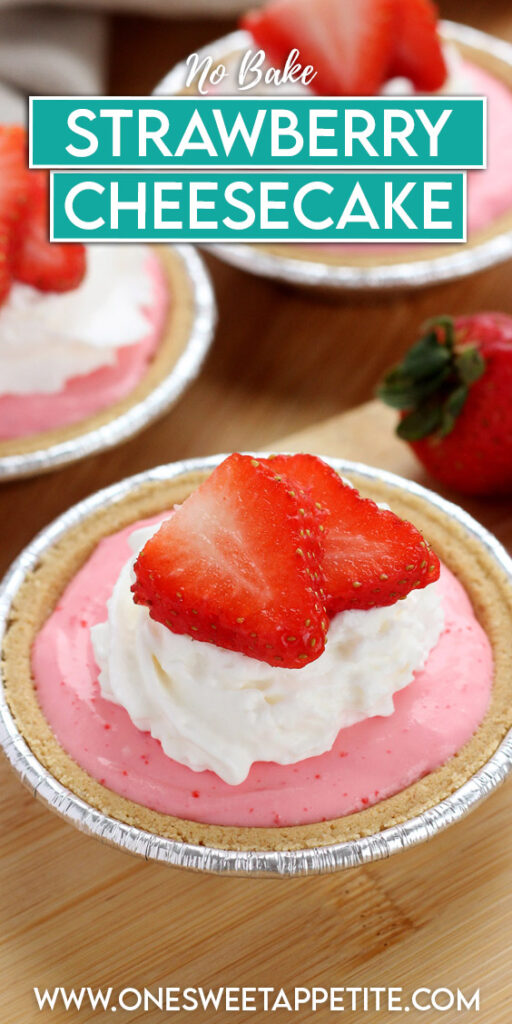 pinterest graphic of a mini cheesecake that is in a foil tin. Topped with whipped cream and two slices of strawberry. Text overlay on the image reads "no bake strawberry cheesecake"