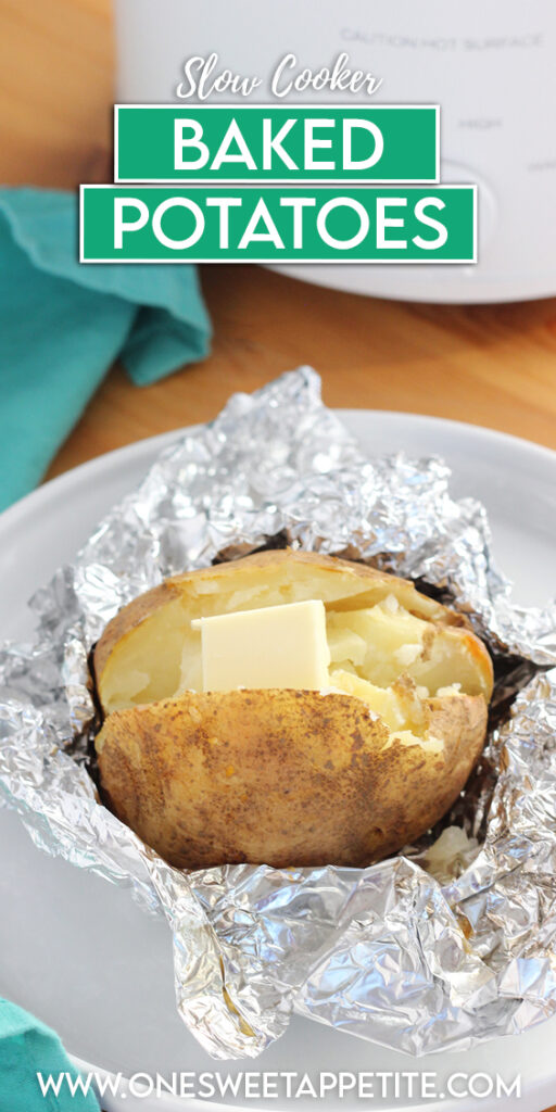 image showing a wooden table top with a small white crock pot off in the background with a teal napkin. There is  a small round white plate with a baked potato that is wrapped in foil partially and has a tab of butter on top. Text overlay reads "slow cooker baked potatoes"