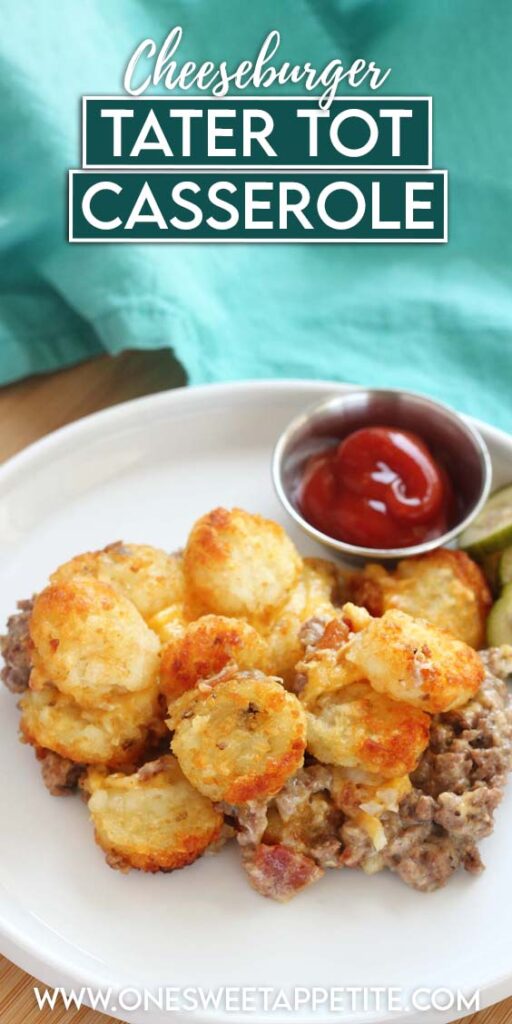 Close up image of a white round plate topped with a tater tot casserole with a side of bacon and ketchup. A teal napkin off in the background. Text overlay reading "cheeseburger tater tot casserole"