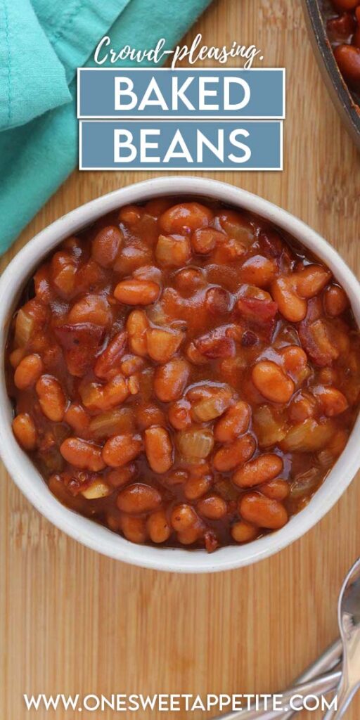 Top down image showing a small white bowl filled with beans. The bowl is on a wooden tabel top with a teal napkin and spoons. Text overlay reads "crowd pleasing baked beans"