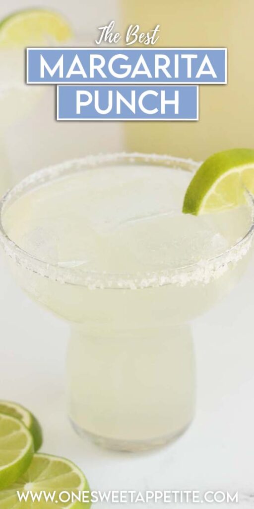 close up image of a margarita glass filled with ice and cocktail with a rimmed edge and lime wedges. Text overlay reads "the best margarita punch"