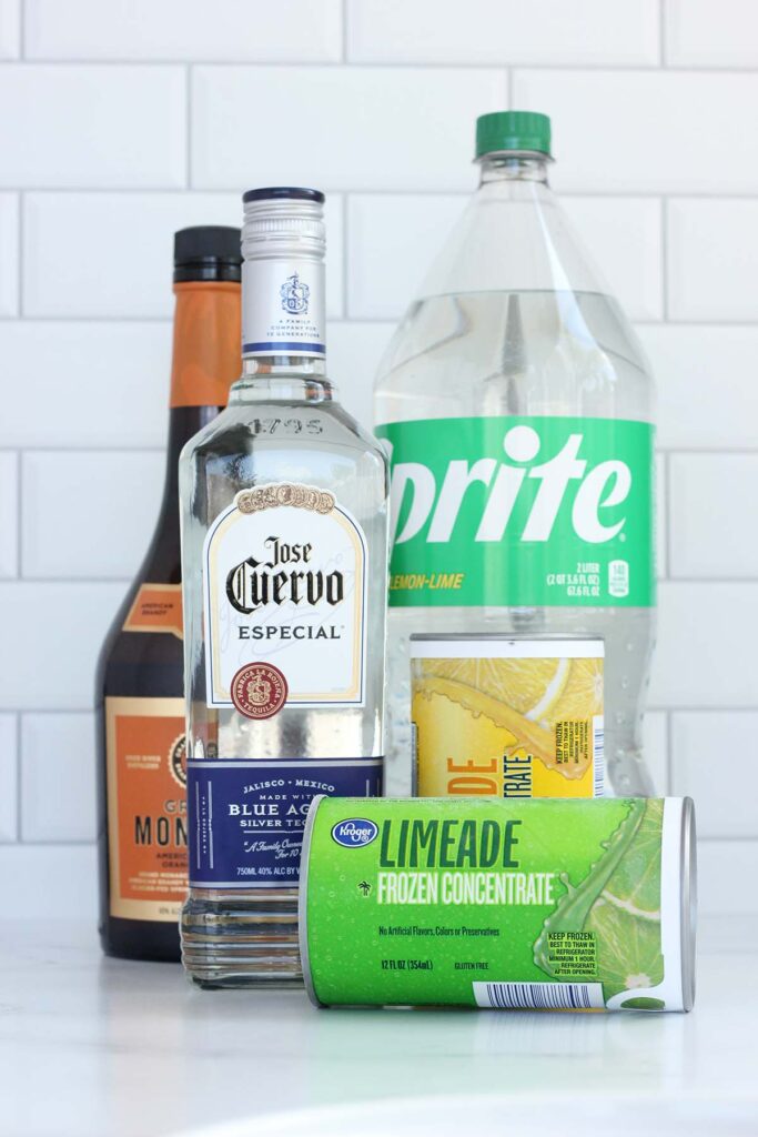Image showing limeade and lemonade concentrate, sprite, tequila, and orange liquor on a white table