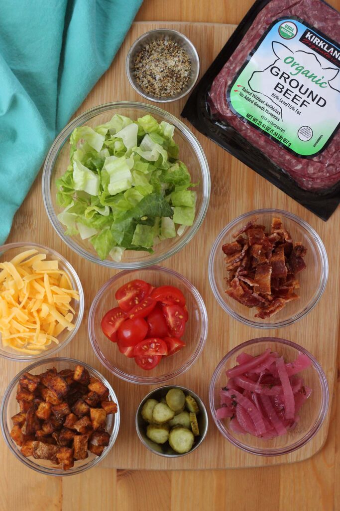 ground beef
burger seasoning
lettuce
bacon
tomato
cheese
potatoes or french fries
pickles
onion (we like pickled onion)
in bowls