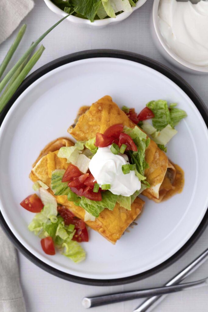 These beef enchiladas are my go-to when I want something hearty but still easy to pull off on a weeknight. The warm tortillas, savory beef, mellow green chilis, and melty cheddar all come together under a blanket of rich sauce for the kind of meal everyone asks for seconds of.
Growing up, I learned that the best dinners are the ones that feel a little special but don’t require an all-day kitchen marathon. That’s exactly what these enchiladas deliver—familiar flavors, quick prep, and a dish that brings everyone to the table.