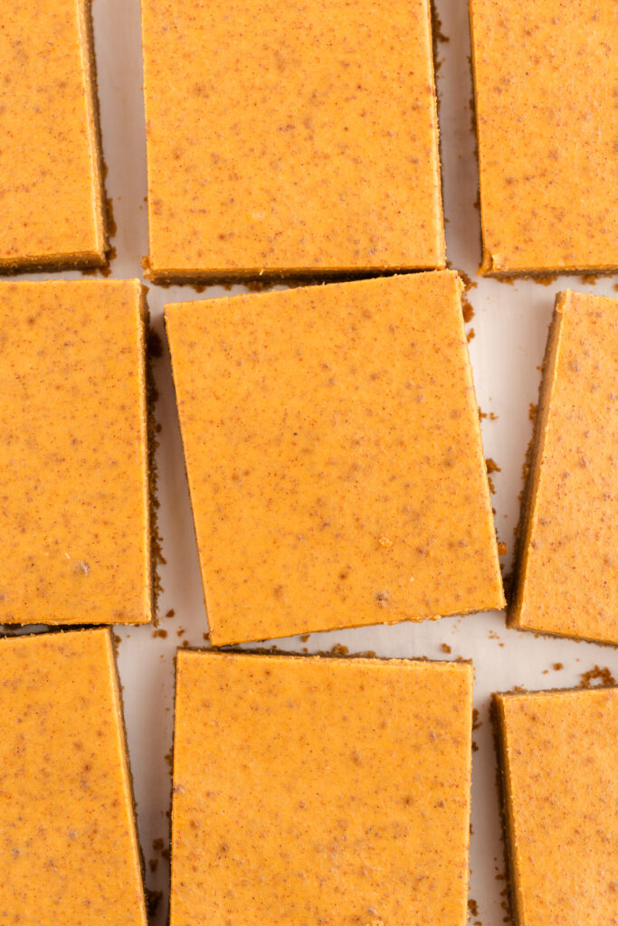 close up image showing pumpkin pie squares on a white plate