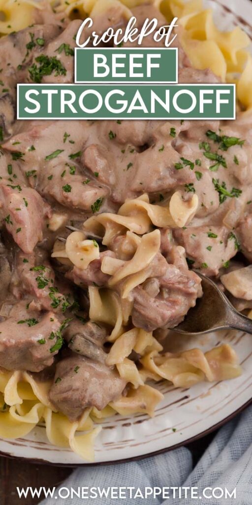 Close up image showing a plate of egg noodles with a saucy beef mix on top with a bite on a fork.