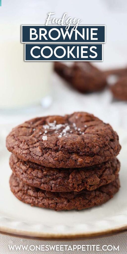 Close up image showing a stack of three brownie cookies on a white plate topped with a sprinkle of salt. Text overlay reads "fudgy brownie cookies"