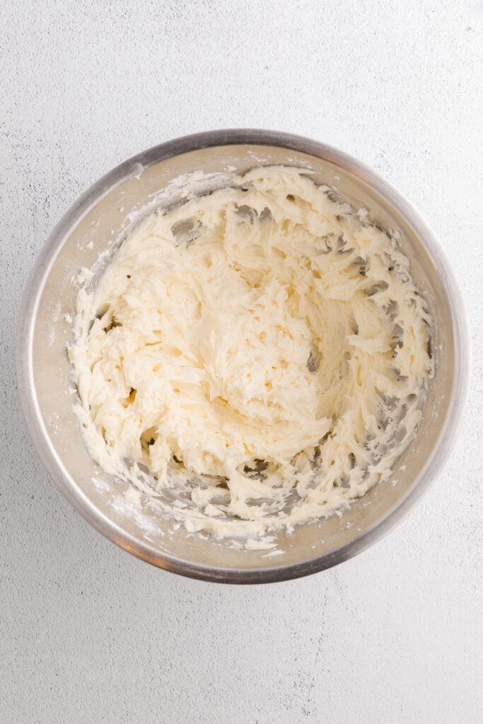 top down image showing the inside of a mixing bowl with frosting
