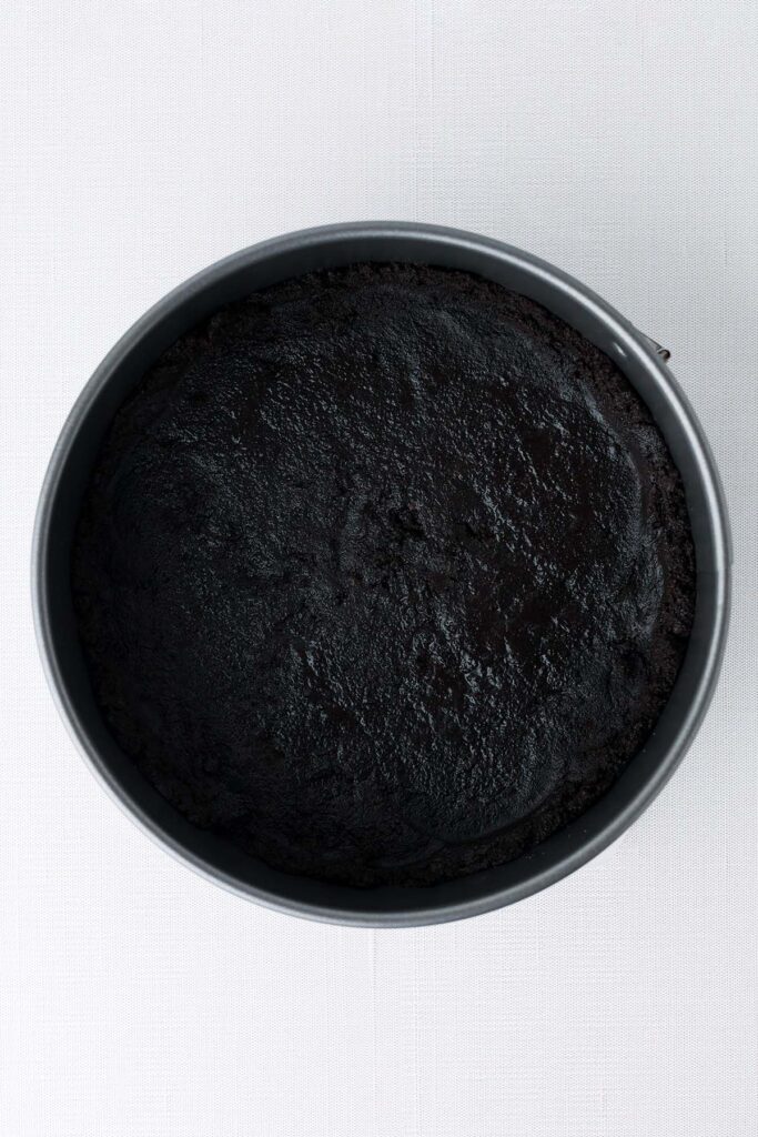 top down image showing an 8 inch pan with a chocolate cookie crust