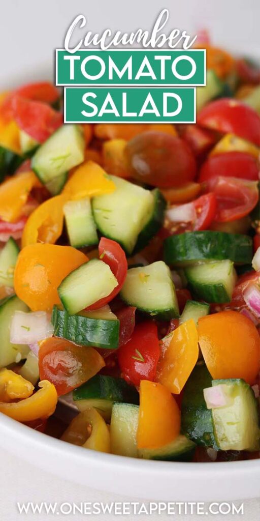 close up image showing chopped cucumber, tomato and onion in a white bowl. Text overlay reads "cucumber tomato salad"