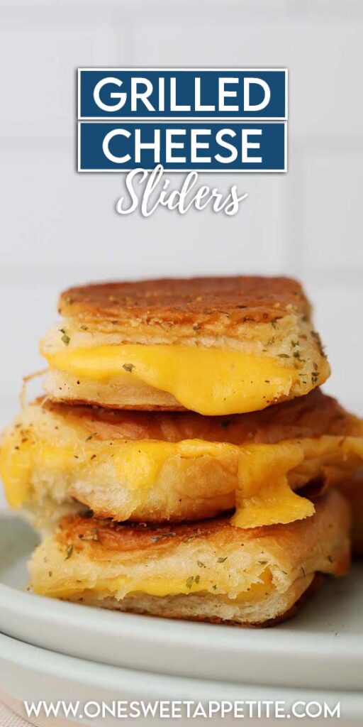 Close up image showing three small grilled cheese stacked on two light blue plates. Text reads "grilled cheese sliders"
