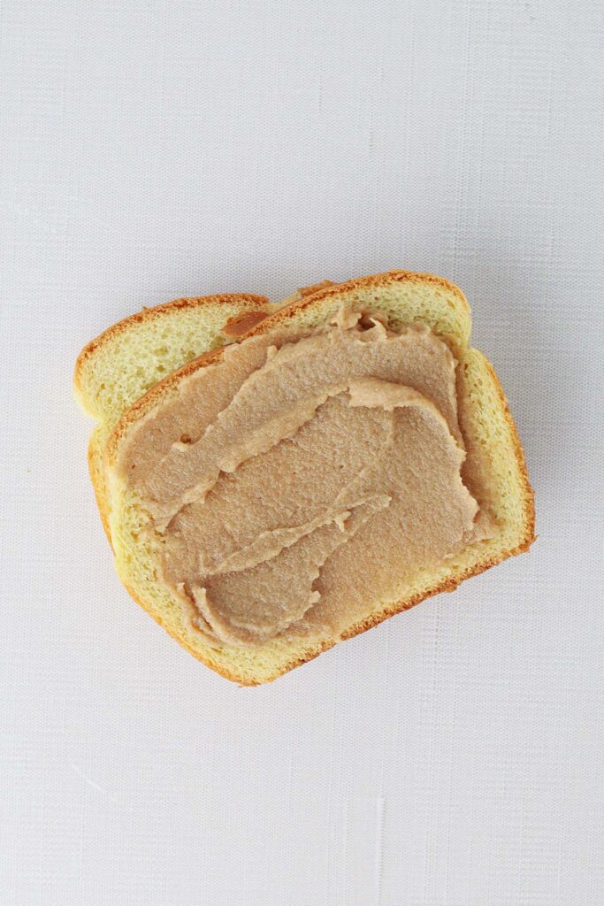 Top down image showing a slice of brioche bread with a spread of cinnamon sugar butter